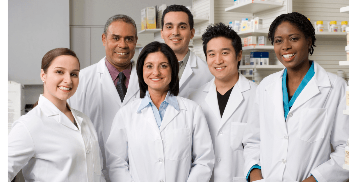 Pharmacy and laboratory team in white coats