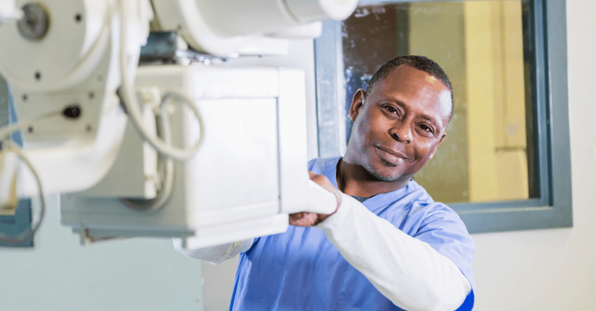 X-ray technologist positioning imaging equipment